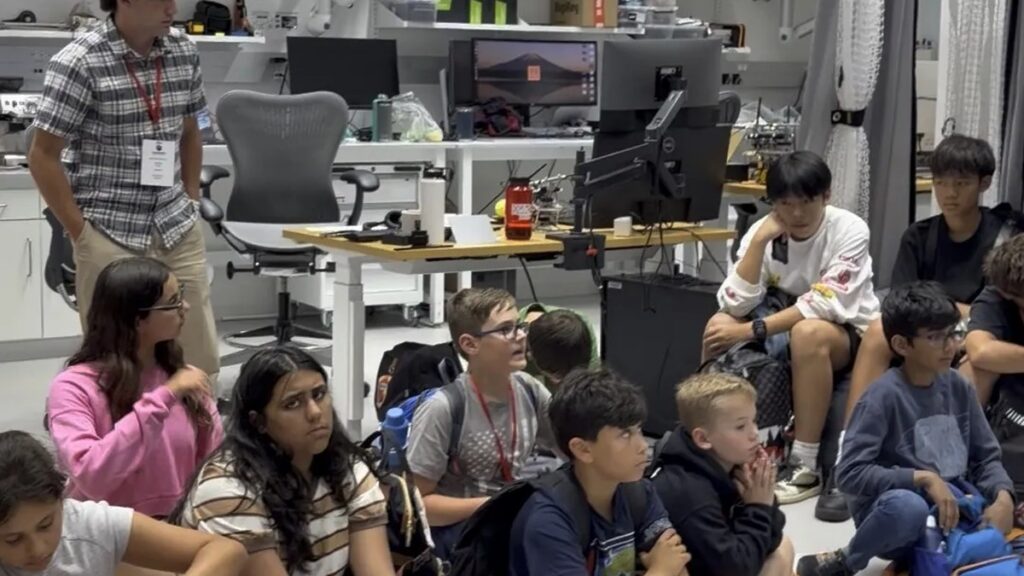 CyberMath students inside a university research lab during a lab visit