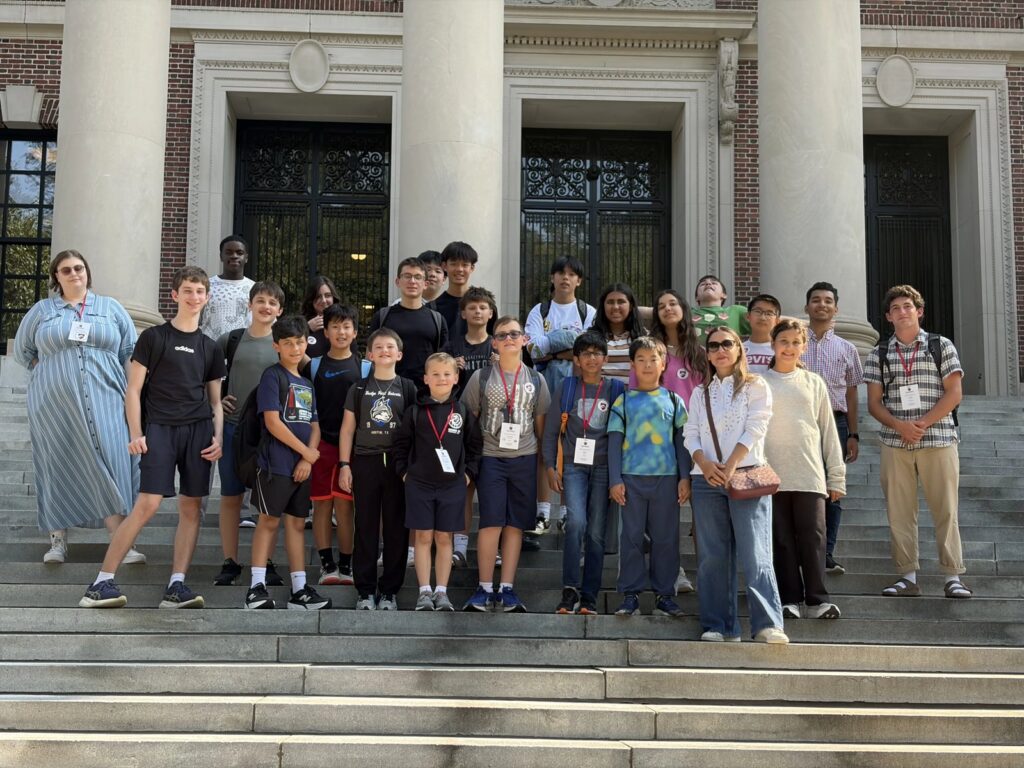 CyberMath summer camp students and staff pose on the steps of a Harvard library building
